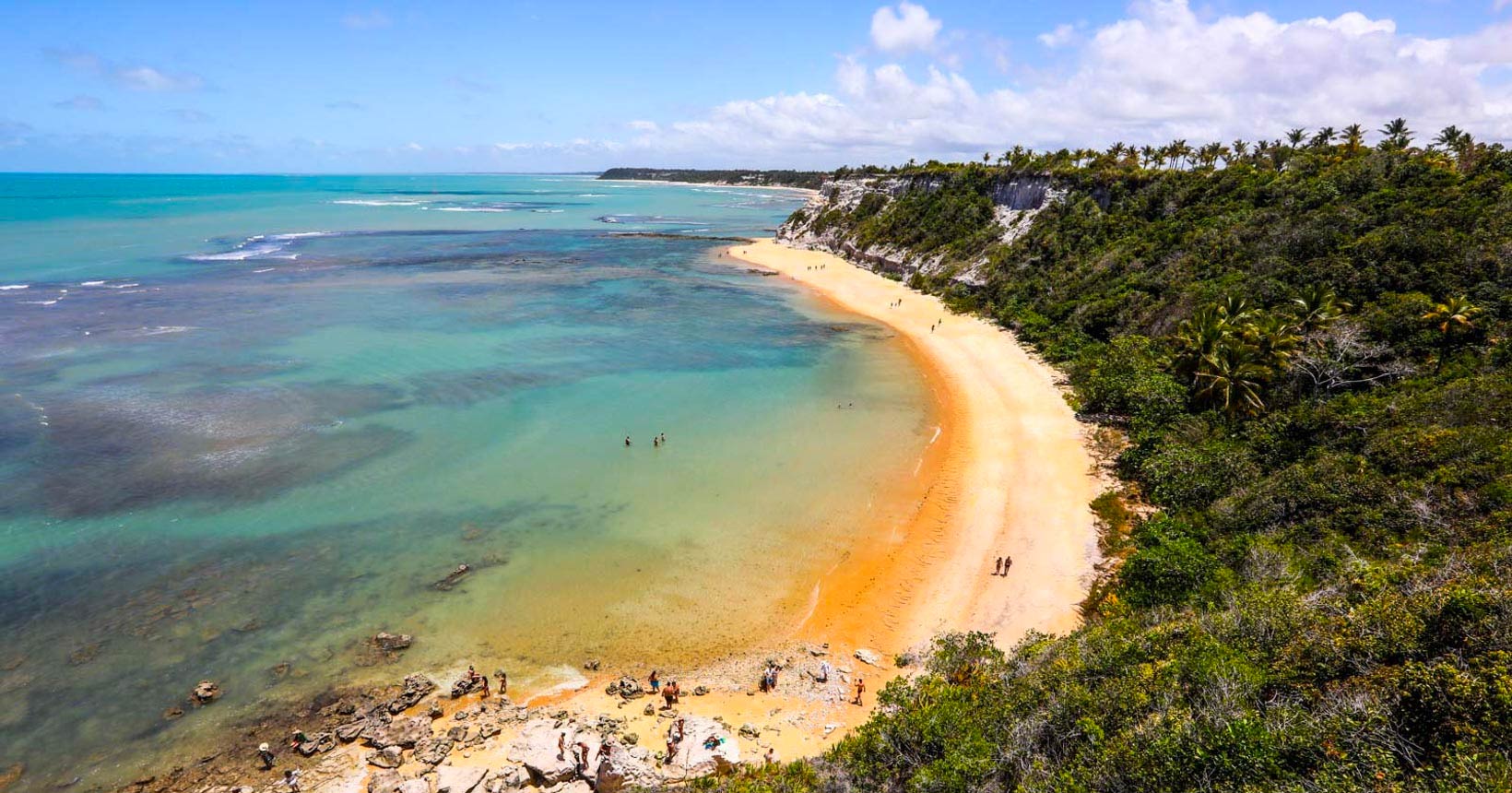 Praia do Espelho with crystal clear turquoise waters reflecting palm trees and white sand